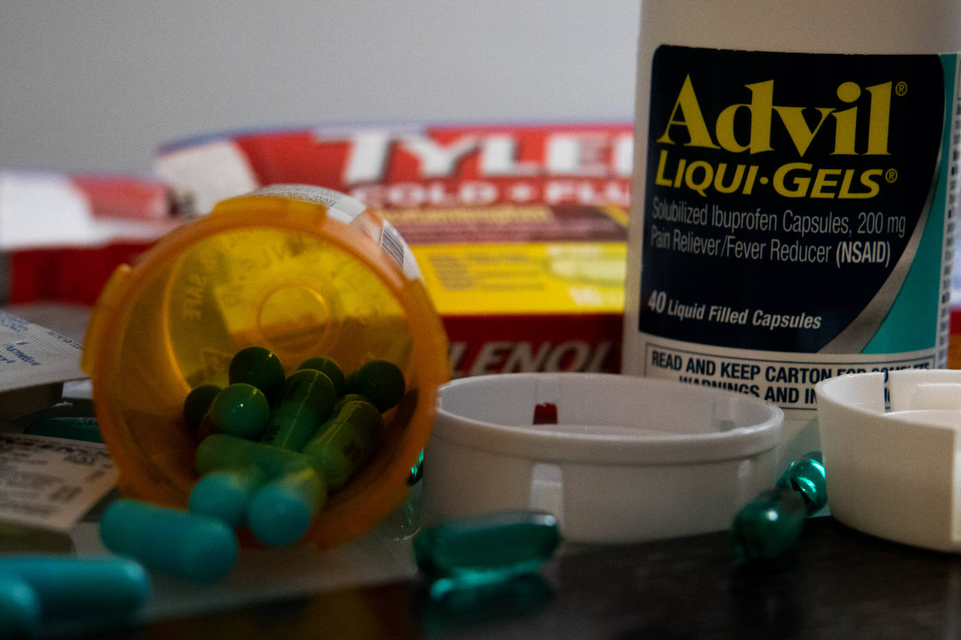 photo of pills and capsules spilling from jars